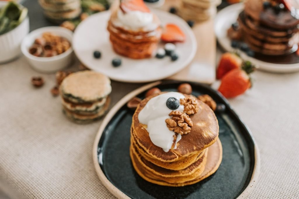 Crafting Captivating Headlines: Your awesome post title goes here A stack of pancakes topped with yogurt, walnuts, and blueberries, perfect for a mouthwatering breakfast.