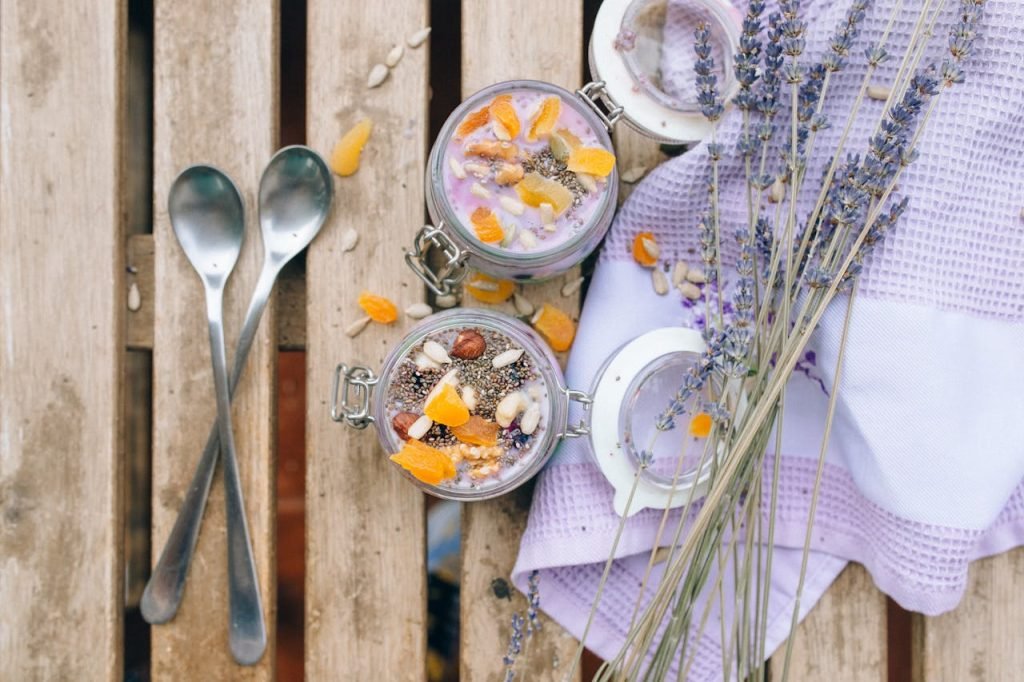 Mastering the First Impression: Your intriguing post title goes here Top view of tasty chia pudding topped with fruits and lavender, perfect for food photography.