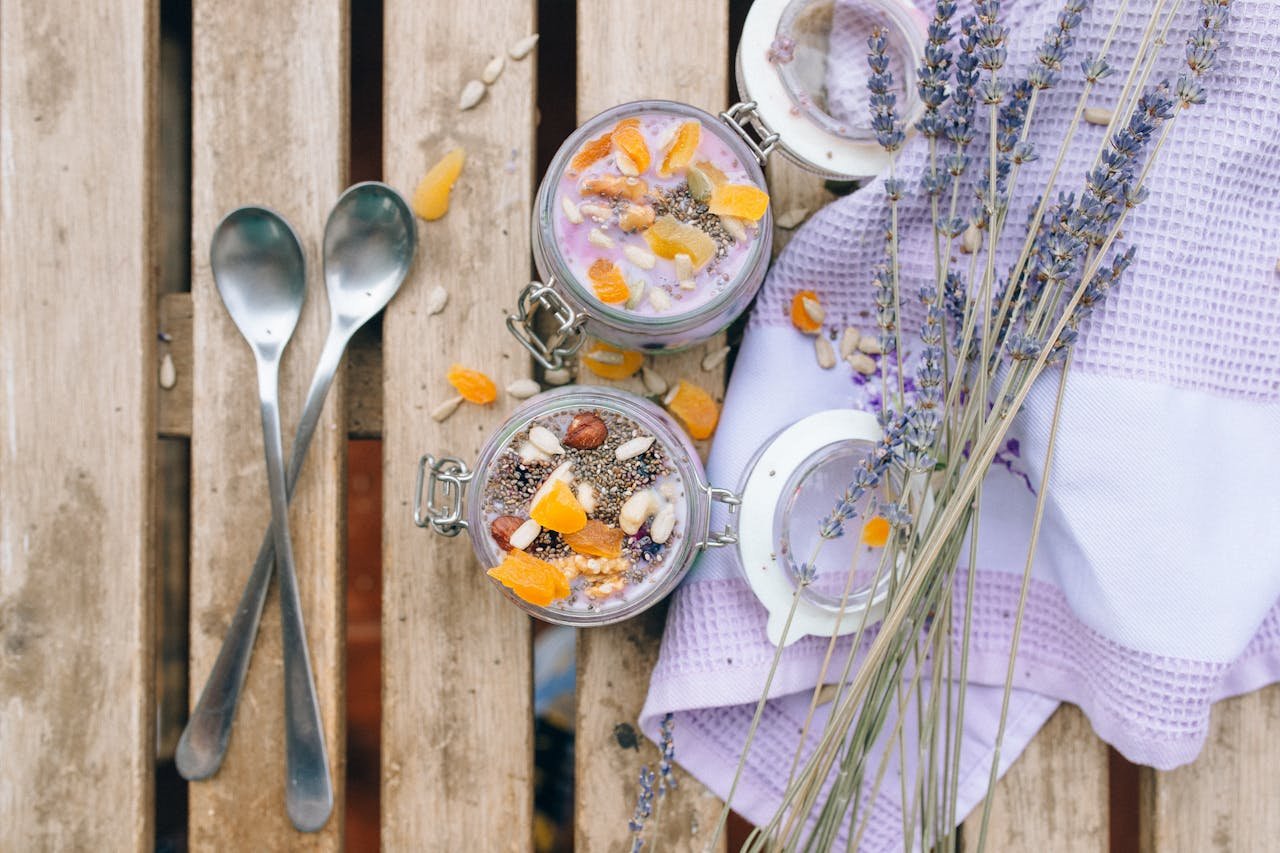 gallery-02 Top view of tasty chia pudding topped with fruits and lavender, perfect for food photography.